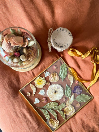 a flower arrangement on a bed